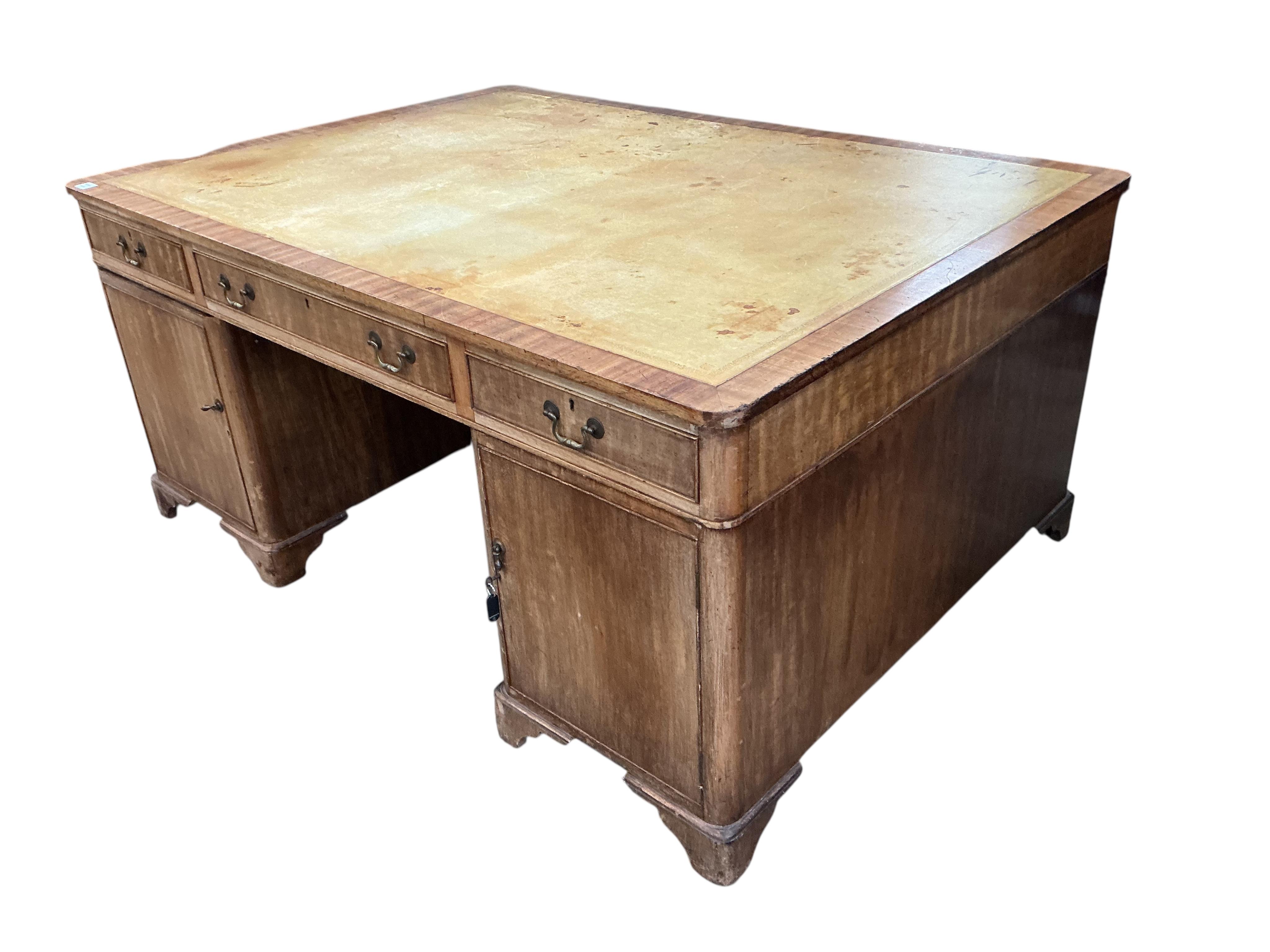 An early 20th century mahogany pedestal partner's desk, width 168cm, depth 122cm, height 78cm